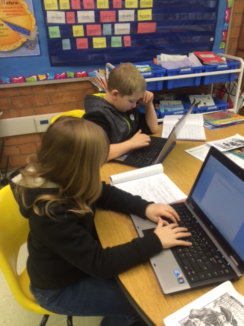 Third grade students type a summary of a nonfiction text they read recently.